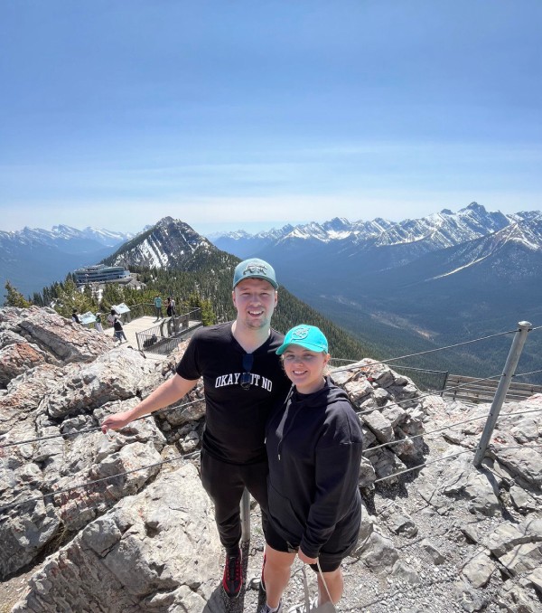 Photo of me and my wife Yuliia on the top of the mountain in Banff, Alberta